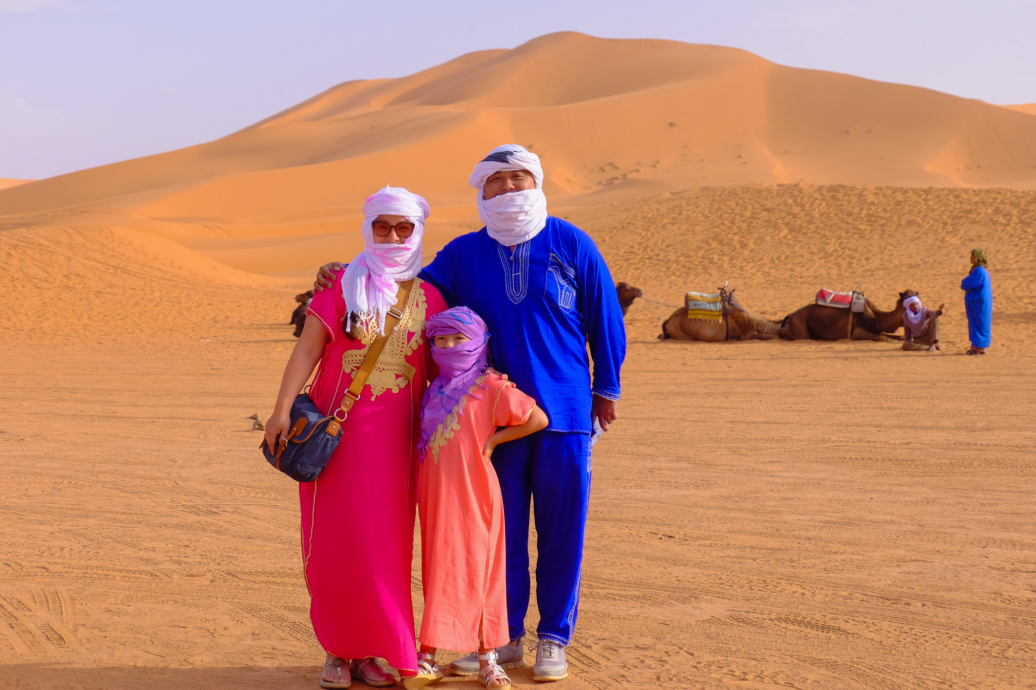 asian family in morocco desert