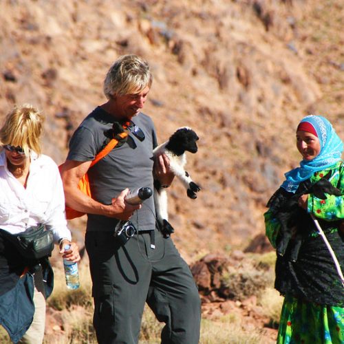 berber moroccan woman and couple trekkers