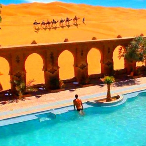 man-in-merzouga-desert-swiming-pool