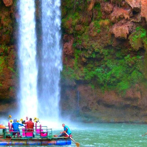 people enjoying boats in ouzoud