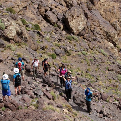 trekkers in atlas mountains morocco