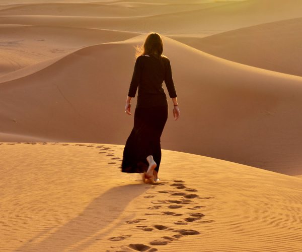 woman walking in sahara